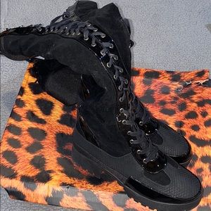 Black leather tall high knew boots with zipperlace